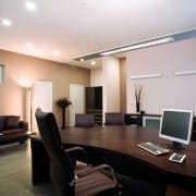 Office cleaning in board room with high end furniture