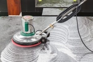 Office Cleaning Services Penticton - Thai people cleaning black granite floor with machine and chemicals 