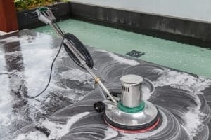 Vancouver Janitorial Cleaning Services - Thai people cleaning black granite floor with machine and chemicals